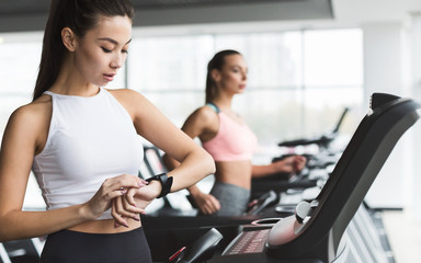 Woman marking time before running on treadmill
