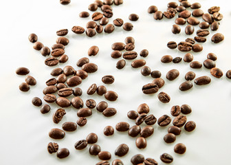 Coffee beans scattered isolated on white background