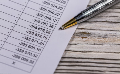 Business Document and Ballpoint Pen Lying on table