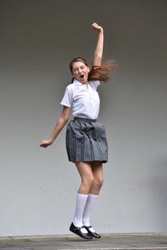 Cute Colombian Teenage Female And Happiness Wearing Skirt Standing