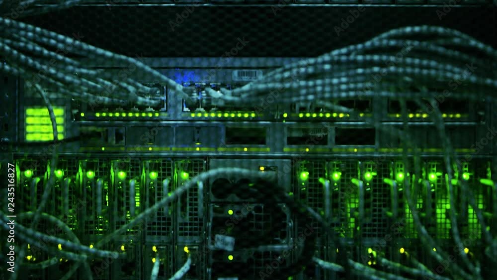 Poster close-up shot in data center: insides of the working server rack showing hardware equipment, fiber o