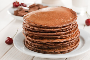 Huge pile of brown pancakes