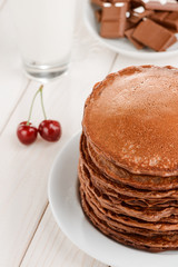 Pancakes with chocolate and cherries