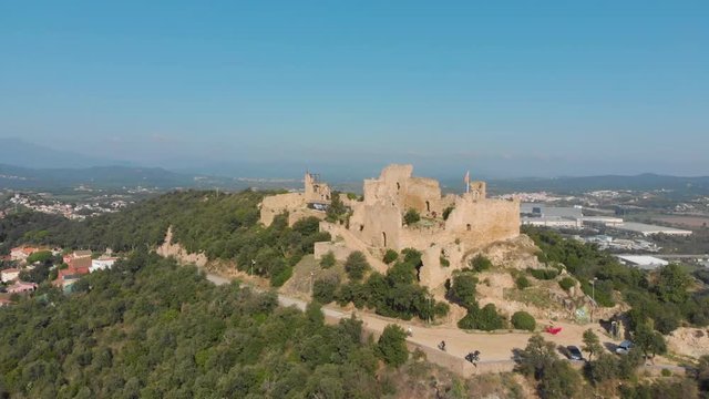 Beautiful landscape of the Palafolls Castle ruins on a sunny day. Catalonia Spain. Aerial view travelling
