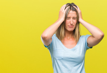 Fototapeta premium Young beautiful woman over isolated background suffering from headache desperate and stressed because pain and migraine. Hands on head.