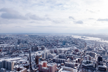 Winter landscape from a aerial view of the city of Novosibirsk in the haze, of the streets with a...