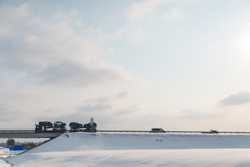 cars at highway road in winter time