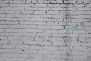 Background of old brick wall with peeling plaster, texture.