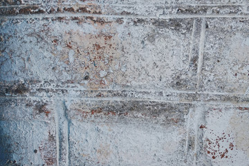 Background of old brick wall with peeling plaster, texture.