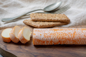 Fagotin cheese with  orange coloured rind made from cow milk in caves of Maredsous abbey, Belgium