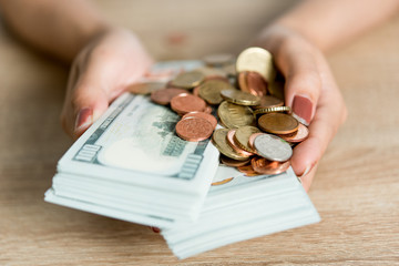 Pictures of hands and money of businessmen on the desk. Saving ideas with copy space.