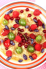 breakfast oatmeal with berries and honey on white wooden background flat style top view overhead summer menu
