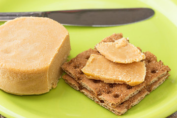 Traditional Norwegian breakfast, sandwiches with brown cheese brunost.