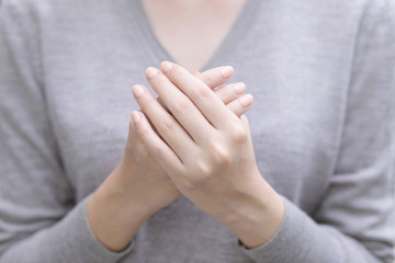 Close up of hands of woman showing with beautiful manicure fingernail and skin.