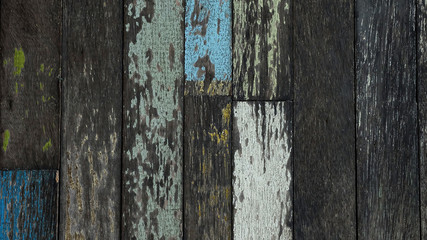 Texture or background of yellow, green and blue pained and plain wood wall, economic design from...