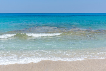 Fototapeta na wymiar Seascape with Agios Ioanis beach with blue waters, Lefkada, Ionian Islands, Greece