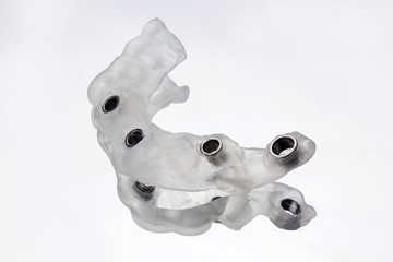 Naklejka premium Photo quality surgical template on six implants removed on a mirror with white background