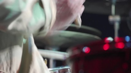 Drummer on snare, close-up on hands-sticks, from behind