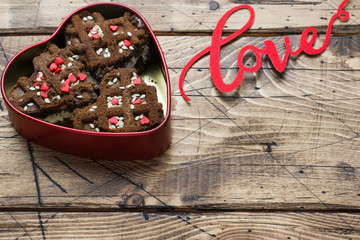 Fototapeta na wymiar Concept Valentine's Day. Chocolate chip cookies on a wooden table. Greeting card. Copy space
