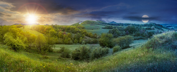 Fototapeta na wymiar panorama of time change in springtime countryside with sun and moon. grassy hills and meadows. trees with green foliage on hillsides. mountain top in the distance. wonderful nature scenery