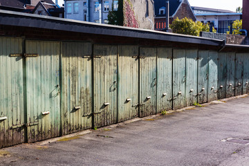 garage yard in the city with old wooden garage doors