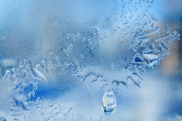 Naklejka na ściany i meble frost texture on the window glass in spring
