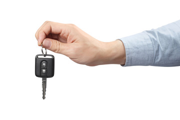 Hand holding a car key, isolated on white background