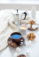 Cozy home breakfast with coffee and cookies on table
