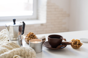 Cozy home breakfast with coffee and cookies on table