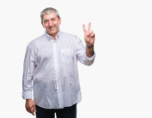 Handsome senior man over isolated background smiling with happy face winking at the camera doing victory sign. Number two.