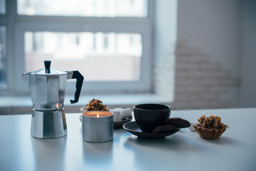 Cozy home breakfast with coffee and cookies on table