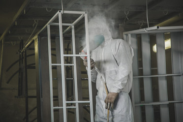 at the factory painting spray gun, Painter working with airbrush