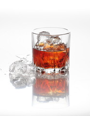 Glasses of scottish whiskey with ice cubes