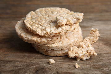Stack of crunchy rice cakes on wooden background