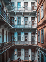 Inner yard of old historical apartment building in Budapest city, Hungary