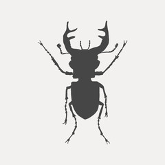 Black silhouette of a stag beetle isolated on white background. Insect vector illustration.