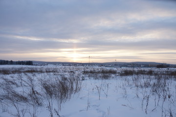 sunset on a snowy field