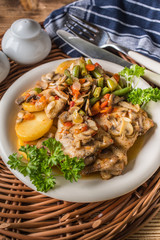 Fillet of chicken legs with stewed vegetables.