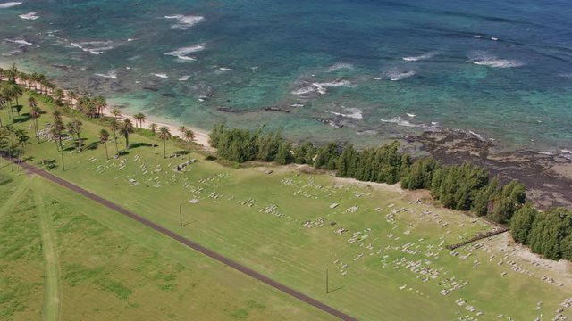 Molokai, Hawaii circa-2018.  Aerial view of Kalaupapa oceanfront cemetery on Molokai.  Shot with Cineflex and RED Epic-W Helium. 