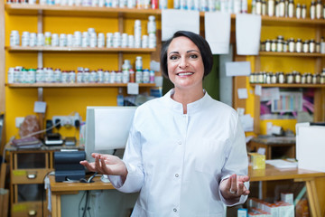 Woman in white coat promoting health supplements in drugstore