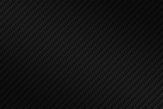 Abstract seamless background of black carbon fiber texture.