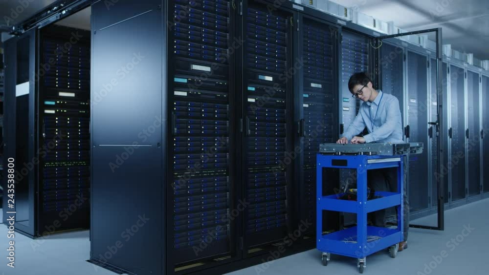 Aufkleber In the Modern Data Center: Team of IT Technicians Working with Server Racks, Man with Pushcart Changes Faulty Hard Drives, Doing Hardware Maintenance and Diagnostics.