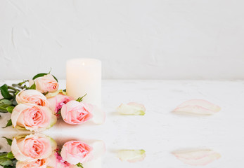 Spa still life with roses and candle near water, water reflection still life spa concept, luxury wellness and spa, clean setting