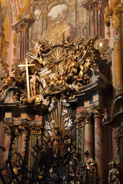 Interior of the Parish Church of St. Nicholas with its stuccos, gilded decorations and painted wood, the fulcrum of the religious life of the city in Hall in Tirol, Austria