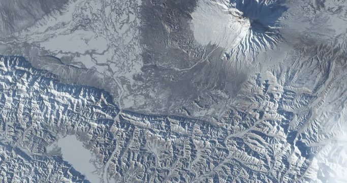 Hurtling toward earth, out of control, over the Kamchatka Peninsula, Russia. Vibration and camera shake. Elements of this image furnished by NASA
