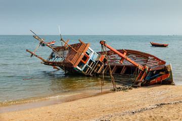 fishing boat crashed lies on its side