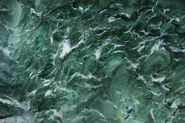 Awesome background of green natural stone marble with a white pattern, called Verde Venezia