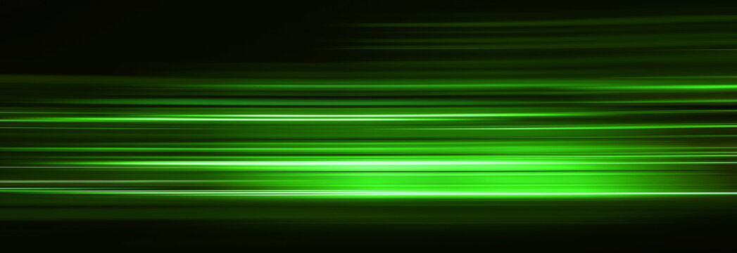 Abstract green light trails in the dark, motion blur effect