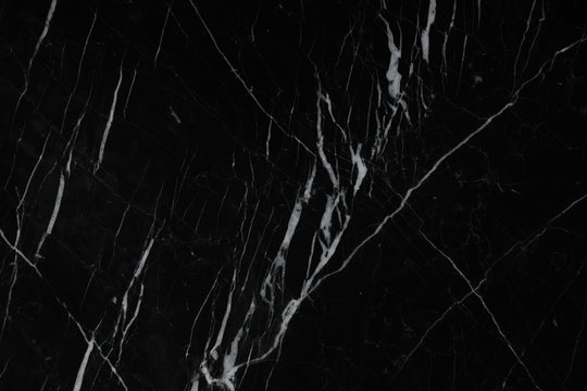 Awesome background of black natural stone marble with a white pattern called Nero Marquina