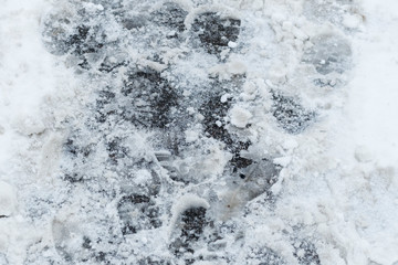 winter snow. path trodden. many footprints. they are dirty.